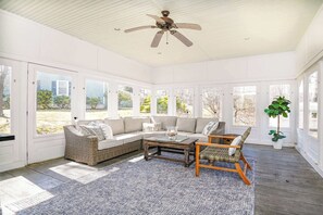 Bask in the sunlight and serenity of our enclosed back patio