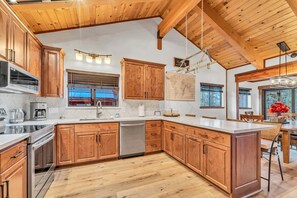 Kitchen 1: Drip coffee maker, toaster, cooking utensils, tableware, main floor