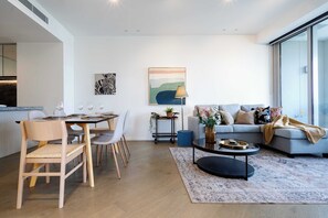 Open plan living room with modern furnitures and art decor