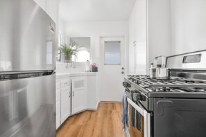 Cook up a storm in this fully equipped kitchen! Updated appliances and stocked with cooking essentials!