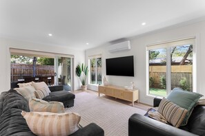 Cozy entertainment space with a TV and multimedia setup for your enjoyment.