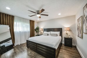 Relax in this spacious bedroom, complete with a cozy king bed, soft linens, and ample closet space. The room includes blackout curtains and a smart TV with streaming options, perfect for unwinding after a day out. Private ensuite bathroom with fresh towels and essential toiletries included.