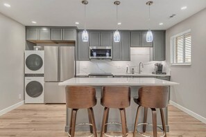 Enjoy a spacious kitchen with top-tier appliances and quartz finishes.