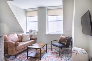 Living room and kitchen with bar stool seating