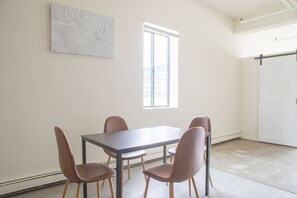 Full kitchen with dining table/workspace