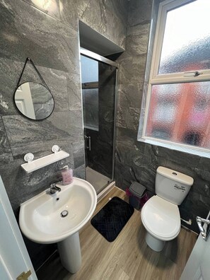 Full Bathroom: - Sink - Toilet - Electric Shower
