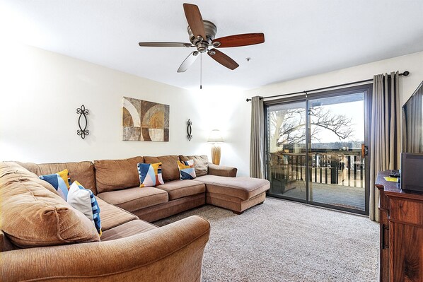 Unwind together in this welcoming space - featuring a super-comfy sectional, large TV, and plenty of room for family game night. Perfect for making those 'remember when' moments!