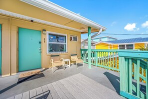 Relaxing front porch with outdoor seating, perfect for enjoying your morning coffee or sunset views.
