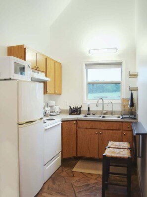 The kitchen is fully equipped with silverware, plates, cups, coffee mugs, dishes, toaster, and coffee maker.  Just bring your favorite food and drinks!