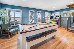 Step into our game room—your ultimate entertainment hub! With a pool table, shuffleboard, and plenty of classic board games, there’s something for everyone to enjoy. Perfect for family fun or friendly competition!