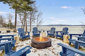 Gather around the firepit and enjoy the breathtaking lake views! 