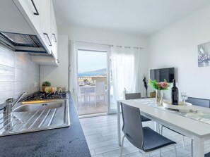 Furniture, Kitchen, Interior Design, Flooring, Apartment, Countertop, Floor, Major Appliance, Home, Kitchen Appliance