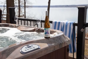 Unwind in the lakeside hot tub with unbeatable views.
