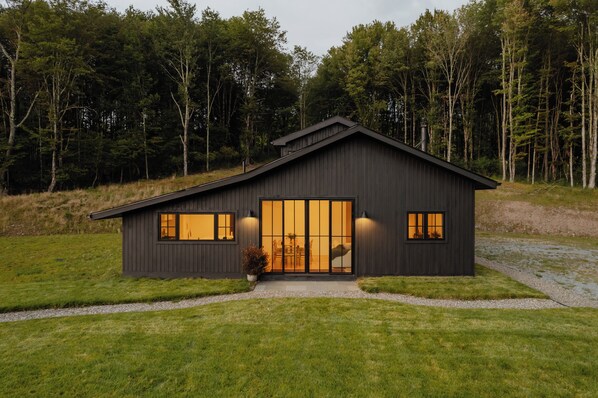 Onyx Ridge is an upscale cabin retreat nestled on 14 private acres in Jeffersonville, New York. Experience modern minimalist design, breathtaking views, and sophisticated comforts that blend rustic charm with contemporary luxury.