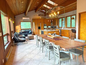 Kitchen with plenty of seating, an island, full size appliances, and two sinks