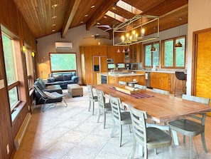 Kitchen with plenty of seating, an island, full size appliances, and two sinks
