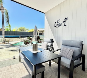 Your private patio, dining area, relaxing, reading, play a game, beside the shared pool. Your "Villa Gemma"