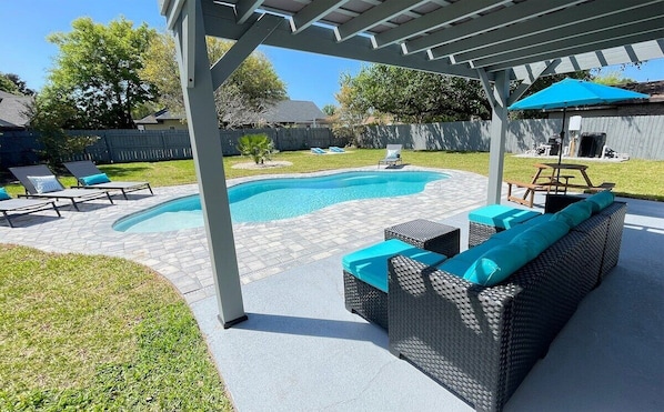 New sparkling pool and spacious backyard to enjoy the sun and cool off after a day at the beach! Pergola, picnic table, cornhole and gas grill make this the the perfect outdoor oasis.
