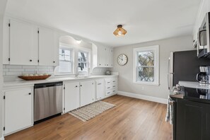 The open, airy kitchen offers ample space & all the comforts of home