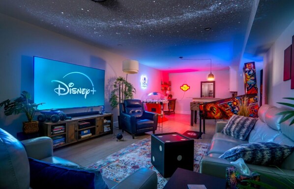 Game room with bunk bed, 6 commercial-grade arcade games, wet bar, and Xbox