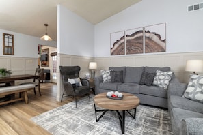 Spacious living room with extra pillows and blankets 