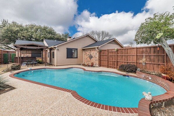 Family friendly swimming pool in private backyard
