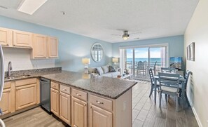 View of the kitchen, living room, and dining area