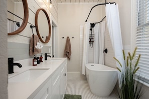 Enjoy the comfort of a bathtub/shower combo in the upstairs guest bathroom, stocked with fresh towels and toiletries.