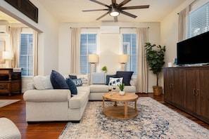Cozy sitting room with comfortable seating and a Smart TV, perfect for movie nights or catching up on your favorite shows.