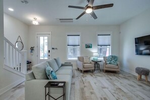 Living Room Ready for Peaceful Relaxation with Large Flat Screen