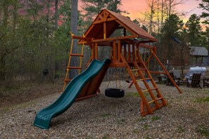 Play set behind the cabin