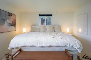 A luxurious bedroom with plush, cozy linens, offering an indulgent escape for the most peaceful, deep sleep you’ve ever experienced.