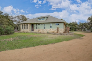 Charming home on three private acres with peaceful surroundings and open skies for a relaxing getaway.