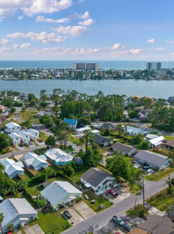 Aerial view of our charming neighborhood — just minutes from the beach, with water views and coastal vibes all around.