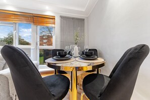 Beautifully furnished dining room with a relaxed, homely atmosphere.