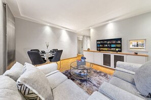 Spacious and stylish living room, with comfortable seating and a welcoming vibe.