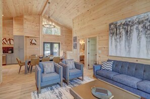 A large modern open concept kitchen/ living space makes for the perfect hang out area for your entire party.