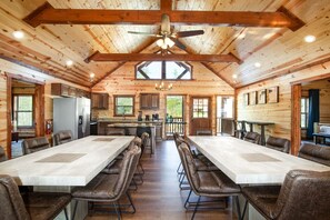 The heart of the home is a cavernous great room, its vaulted ceiling soaring 25 feet, supported by thick pine beams.