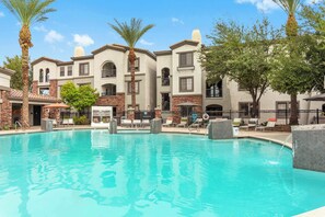 Pool, jacuzzi hot tub, and cabana seating awaits! 