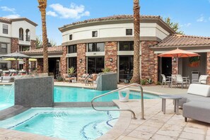 Pool, jacuzzi hot tub, and cabana seating awaits! 