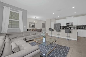 Experience modern comfort in this spacious living area, perfect for family gatherings and relaxation after a day of adventure!
