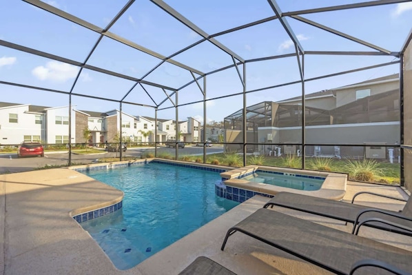 Relax in your private screened pool and hot tub, perfect for unwinding after a day of adventure.