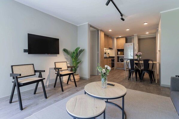 Experience comfort in this modern living space with an open layout, stylish decor, and a cozy kitchen area perfect for your getaway.