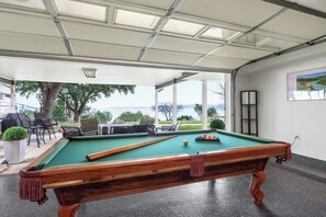 Play a game of pool with a view of the lake