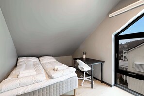 Bedroom with a view.  Plenty of natural light and a serene outlook.