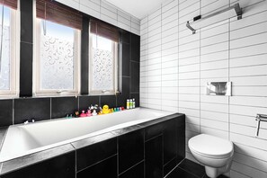 A deep soaking tub for the ultimate relaxation experience.