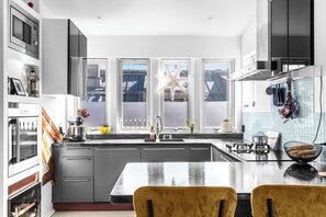 Sleek countertops and premium appliances make cooking a breeze.