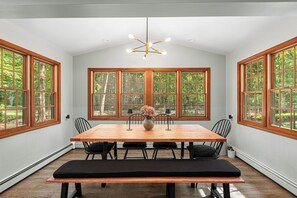 A dining table so chic, even the chandelier is showing off.