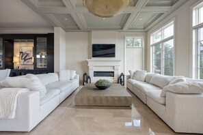 Front living room, boasting gas fireplace, smart tv, 2-10ft sofas 