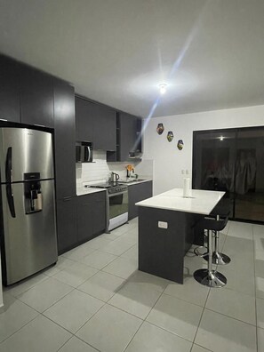 Kitchen with door to back patio